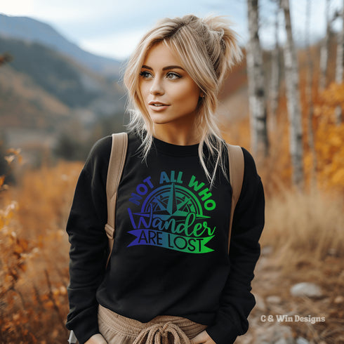 This sweatshirt features a stunning colorful gradient graphic that will make you stand out on your outdoor escapades. With the inspiring saying "Not All Who Wander Are Lost" emblazoned across the front, this sweater is not just a piece of clothing, but a statement of your adventurous spirit and love for exploration.
